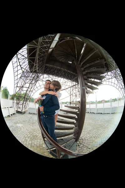 The bride and groom on the background of the tower — Stock Photo, Image