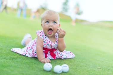 little girl playing golf clipart