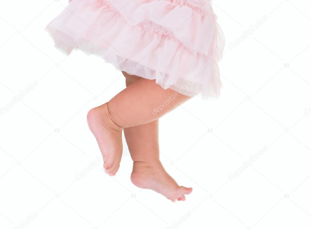 baby girl like a ballet dancer in pink tutu, isolated on white background