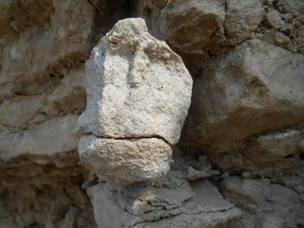 Stone face on the rocks background — Stock Photo, Image