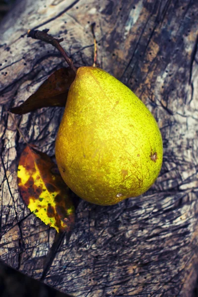 Pear on wood table — Stock Photo, Image