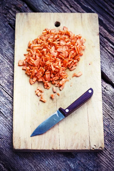 Diced carrots on a chopping board — Stock Photo, Image