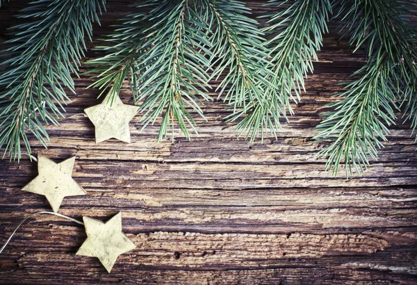 Kerstmis textuur met pijnboomtakken en sterren — Stockfoto