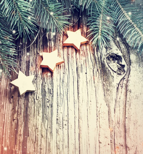 Christmas pine branches and stars — Stock Photo, Image