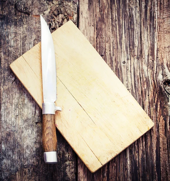 Knife on wooden table — Stock Photo, Image