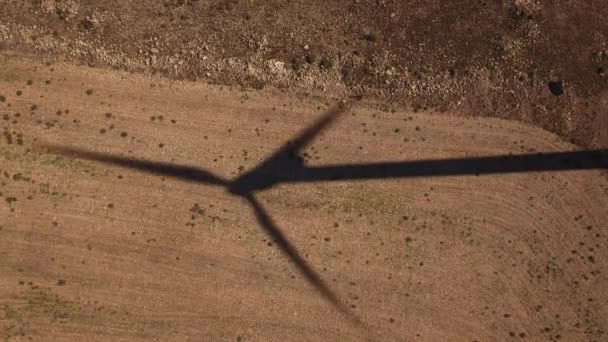 Top view of windmill shadow over cultivated land — Stock Video