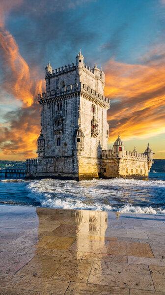 Belem tower under the sky at sunset, vertical composition