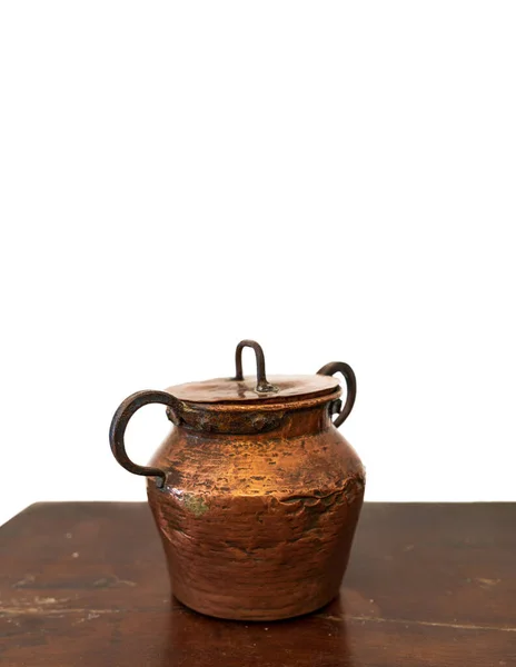 Antique copper pot with lid over the table and white background — Stock Photo, Image