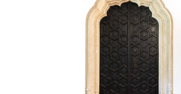 Old antique dark wooden door with stone frame — Stock Photo, Image