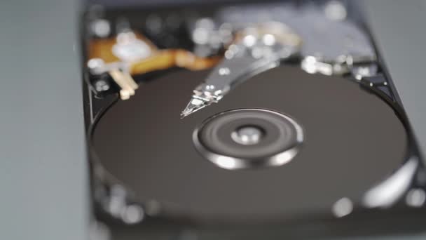 Closeup view of hard disk disks spinning and head — Stock Video