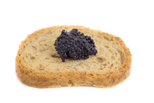 Caviar sobre pedaço de torrada — Fotografia de Stock