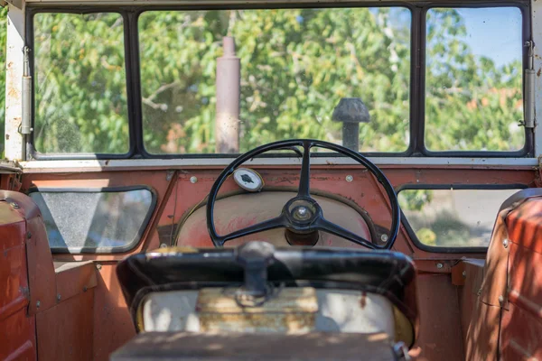 Antique tractor cab with steering wheel — Stock Photo, Image