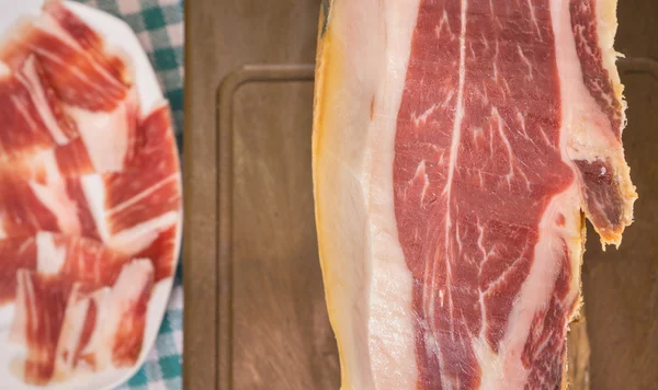 Top view of Serrano ham, plate in the background — Stock Photo, Image