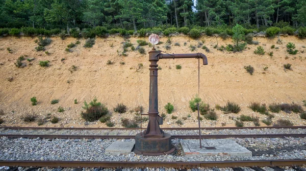 Vintage abandoned railroad water pump — Stock Photo, Image