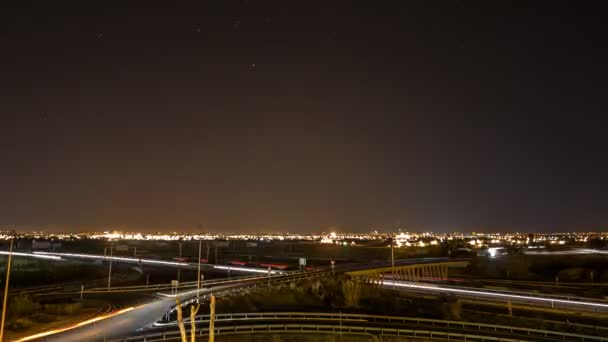 Time lapse with car trails, city skyline and stars — Stock Video