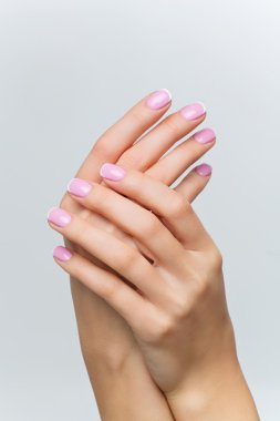 Woman hands with french manicure clipart