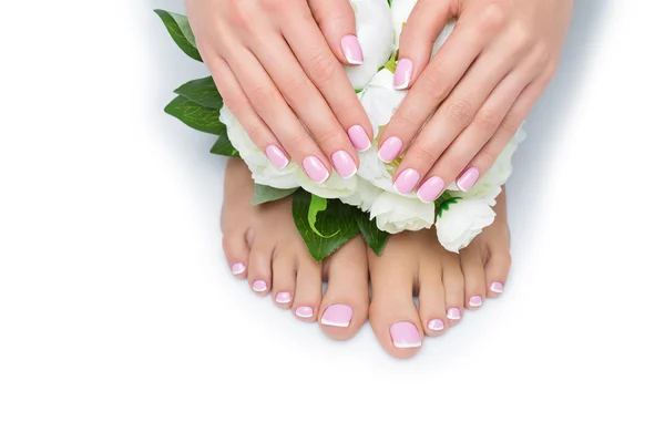 Woman hands and feet with french manicure — Stock Photo, Image