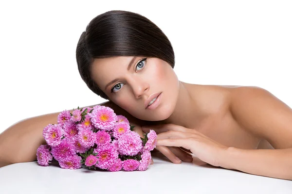 Beautiful girl with flowers — Stock Photo, Image