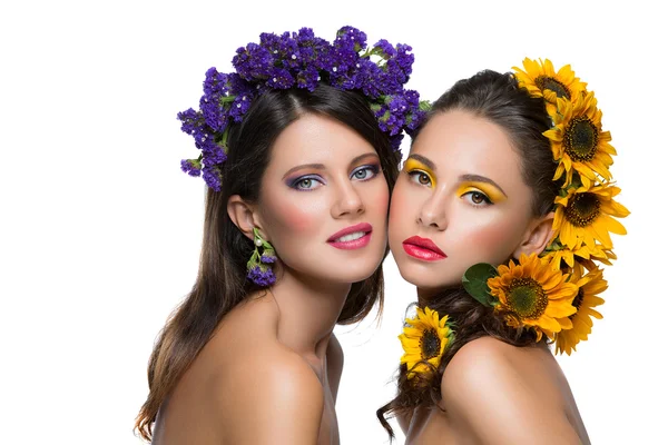 Two girls with flowers in hair — Stock Photo, Image