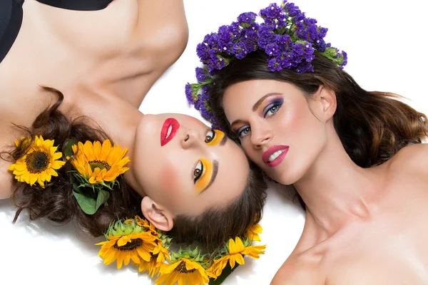 Two girls with flowers in hair Stock Image