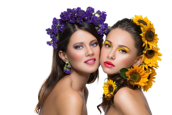 Two girls with flowers in hair Royalty Free Stock Images