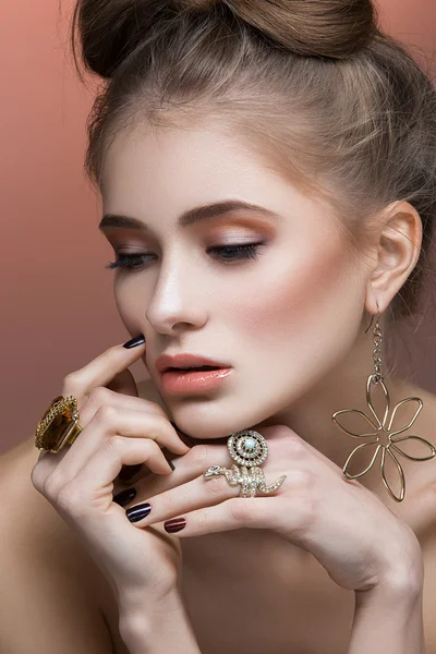 Beautiful girl with hair bow and rings — Stock Photo, Image