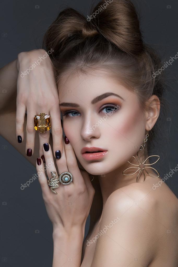 Beautiful girl with hair bow and rings Stock Photo by ©Svetography 105042334