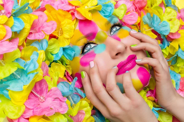 Girl face in flower petals — Stock Photo, Image