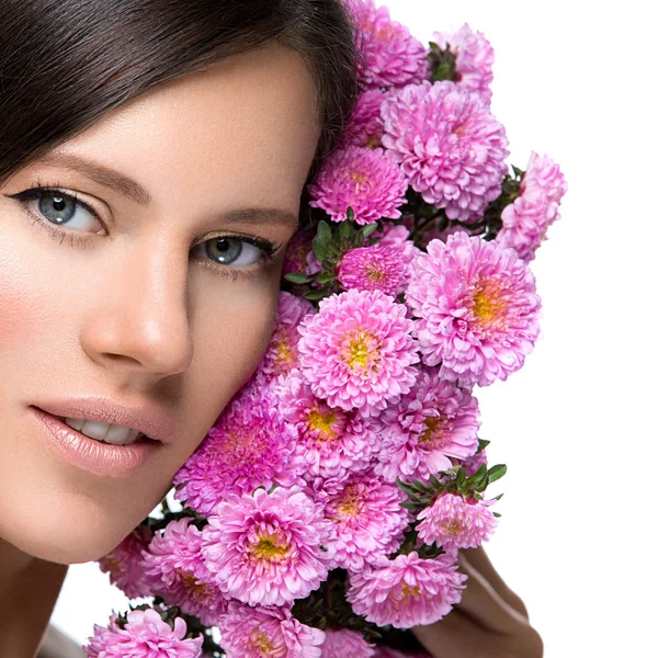 Beautiful girl with flowers — Stock Photo, Image