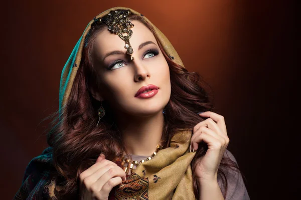 Beautiful young woman in shawl — Stock Photo, Image