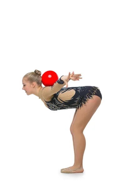 Menina ginasta bonita com bola vermelha — Fotografia de Stock