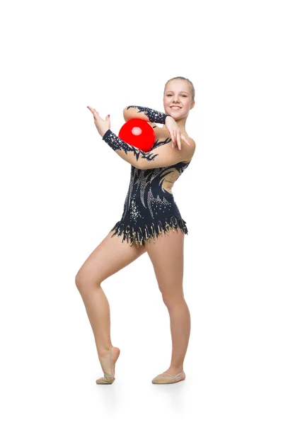 Menina ginasta bonita com bola vermelha — Fotografia de Stock