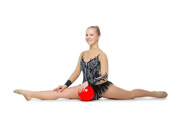 Красивая гимнастка с красным мячом — стоковое фото