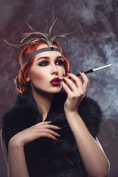 Beautiful girl with smoky eyes and red lips holding cigarette — Stock Photo, Image