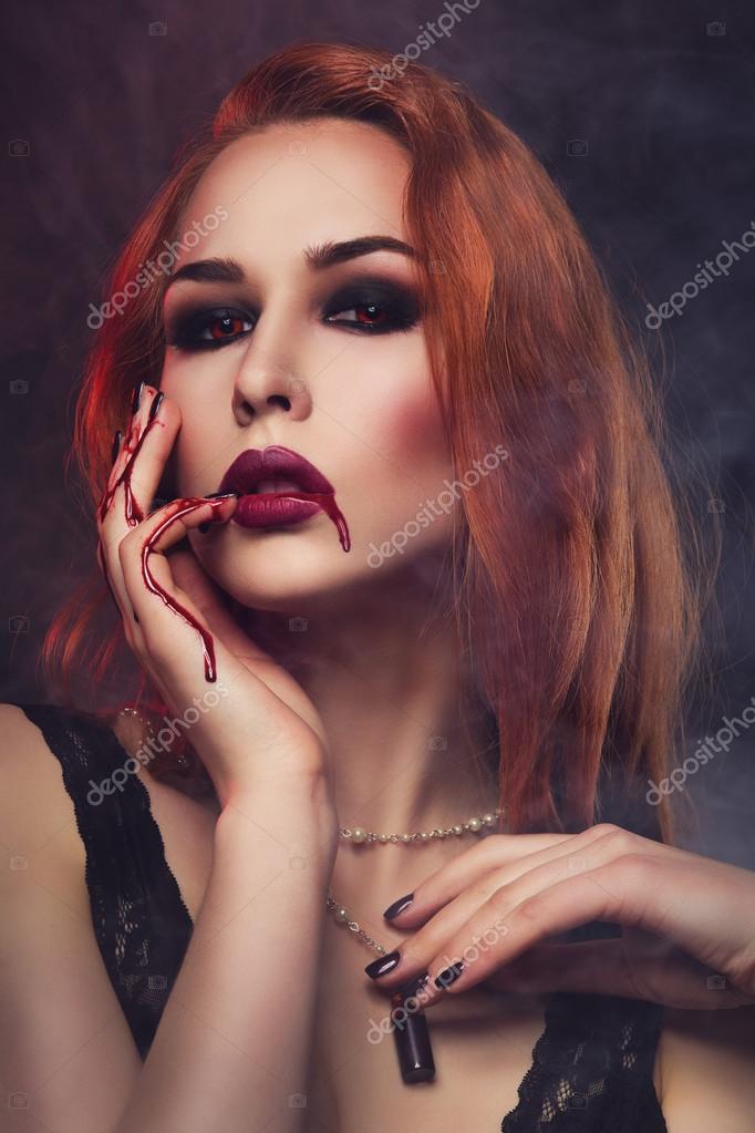 Beautiful vampire young woman Stock Photo by ©Svetography 123074522