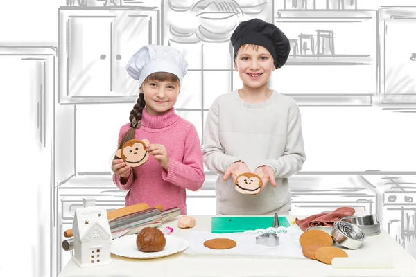 Děti vyrábějící vánoční sušenky — Stock fotografie