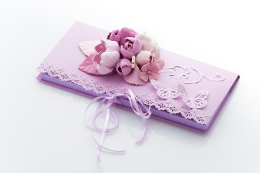 Close up of an invitation envelope decorated with flowers