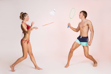 Couple playing badminton clipart