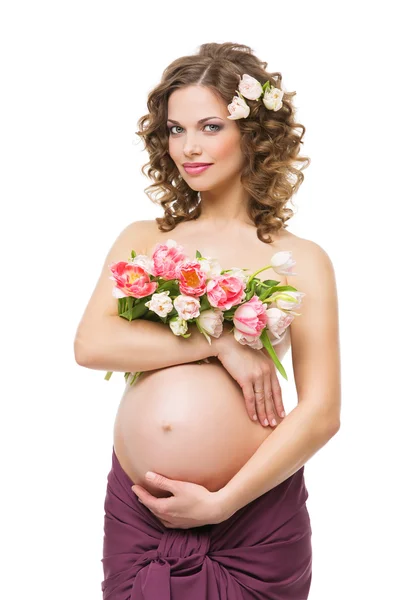 Pregnant woman with flowers — Stock Photo, Image