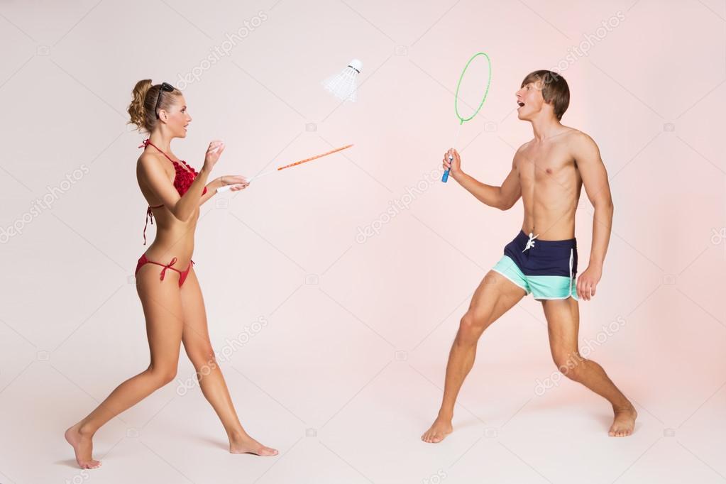 Couple playing badminton