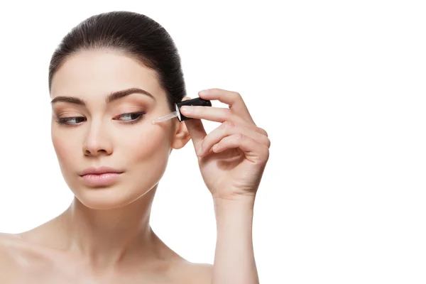 Girl applying serum — Stock Photo, Image