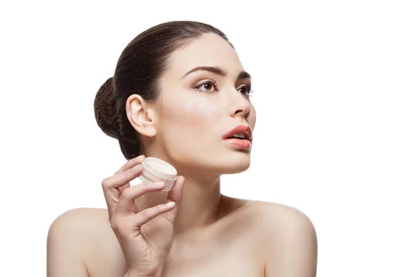 Beautiful girl holding jar with loose powder — Stock Photo, Image