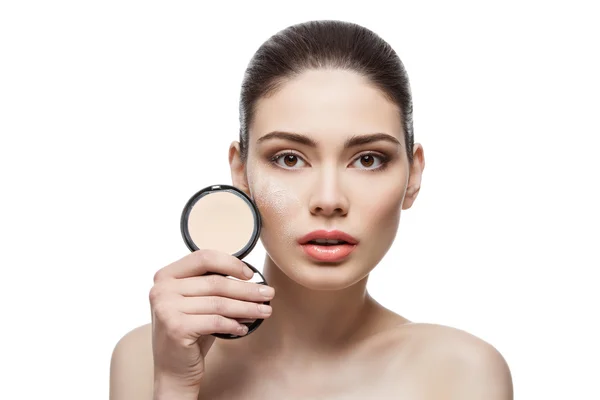 Beautiful girl holding pressed powder — Stock Photo, Image