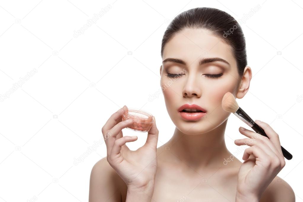 Beautiful girl applying blush with brush — Stock Photo © Svetography