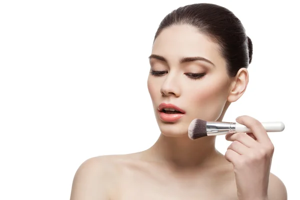 Beautiful girl applying powder with brush — Stock Photo, Image