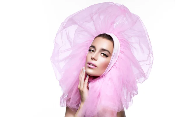 Beautiful girl in fluffy pink headwear — Stock Photo, Image