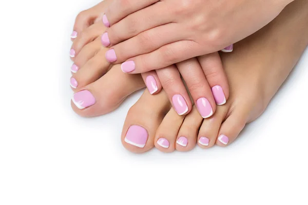 Woman hands and feet with french manicure — Stock Photo, Image