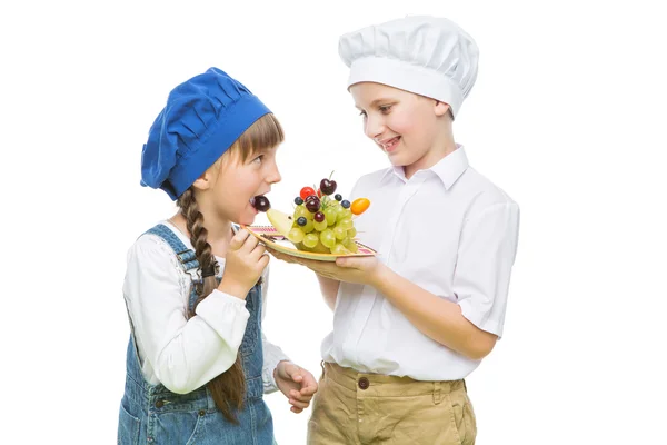 Children holding hedgehog shape fruit snack — Stock Photo, Image