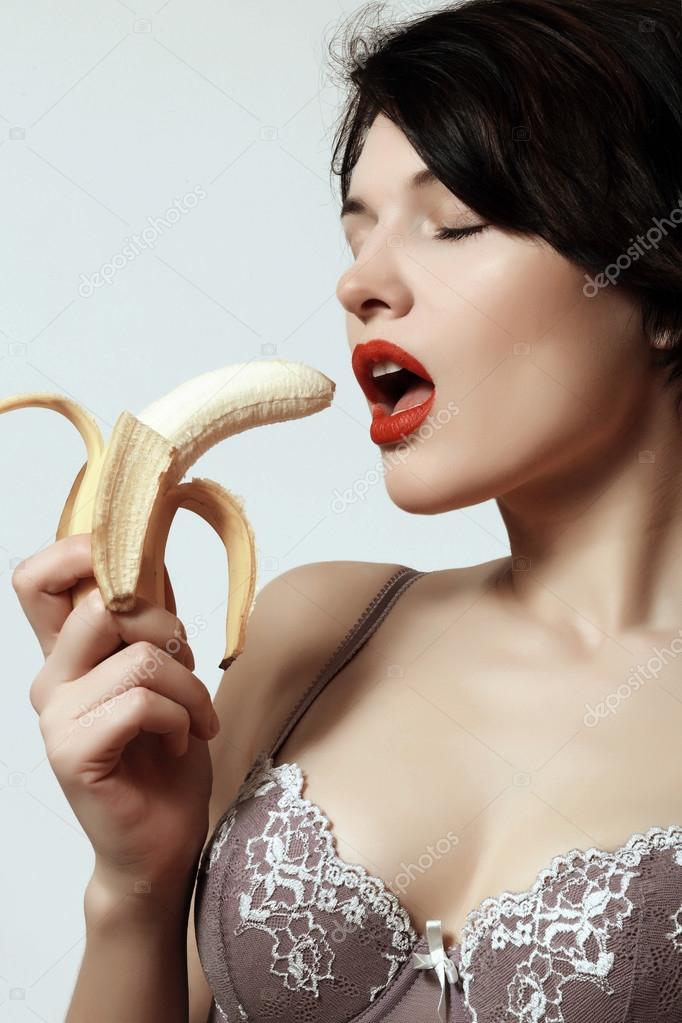 Sexy girl with banana. Underwear. Makeup. Emotions. Passion. Stock Photo ©Volicholi 103705912