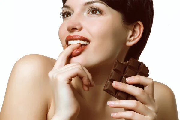 Young woman eating a delicious chocolate — Stock Photo, Image